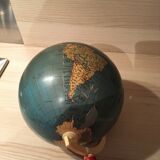 Earth globe ancient wooden foot