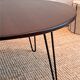 Round coffee table with mahogany wood top