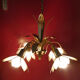 Brass chandelier and flowers in mother-of-pearl petals