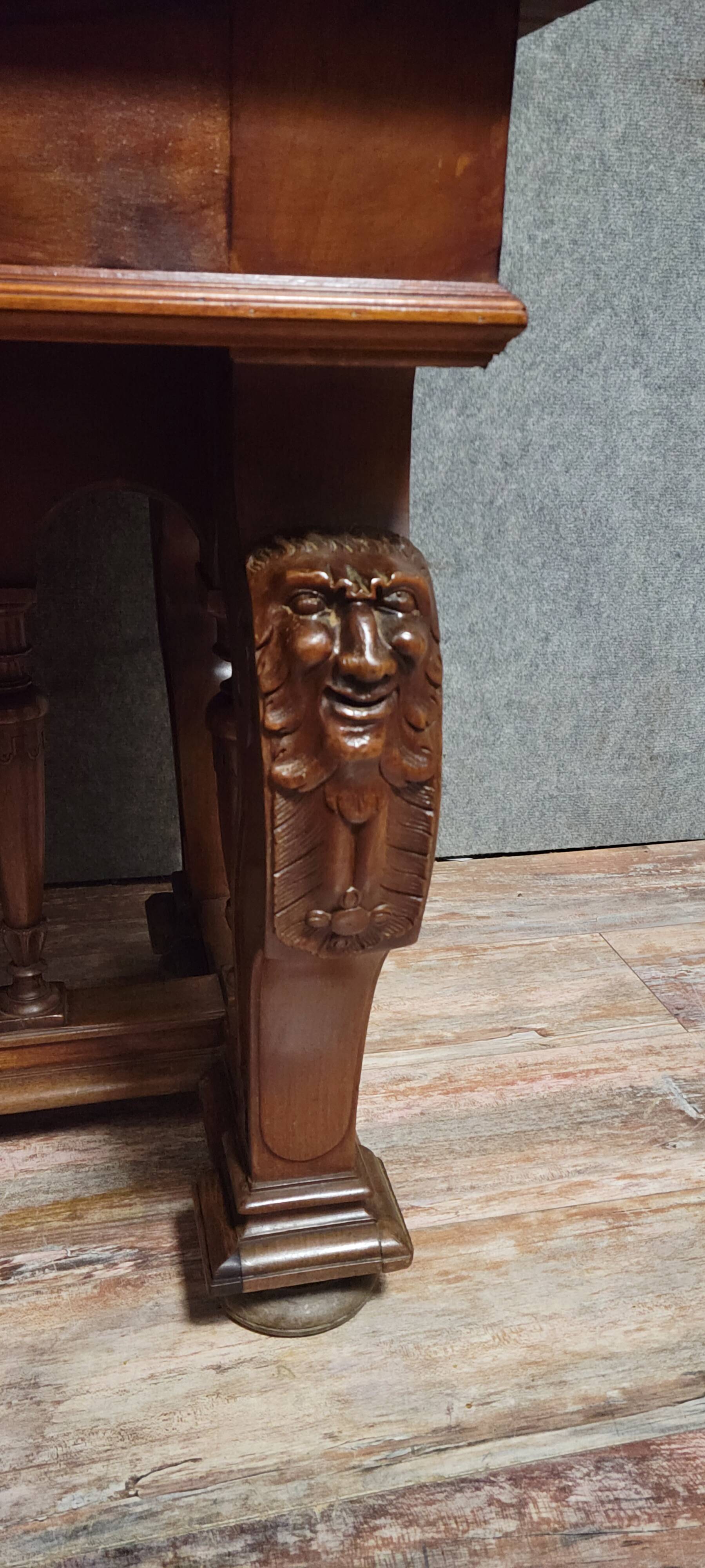 Antique desk in Renaissance style made of walnut from the late 19th century.