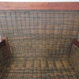 2 colonial-style armchairs in woven rattan and exotic wood