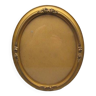 Old oval frame in wood and gilded stucco