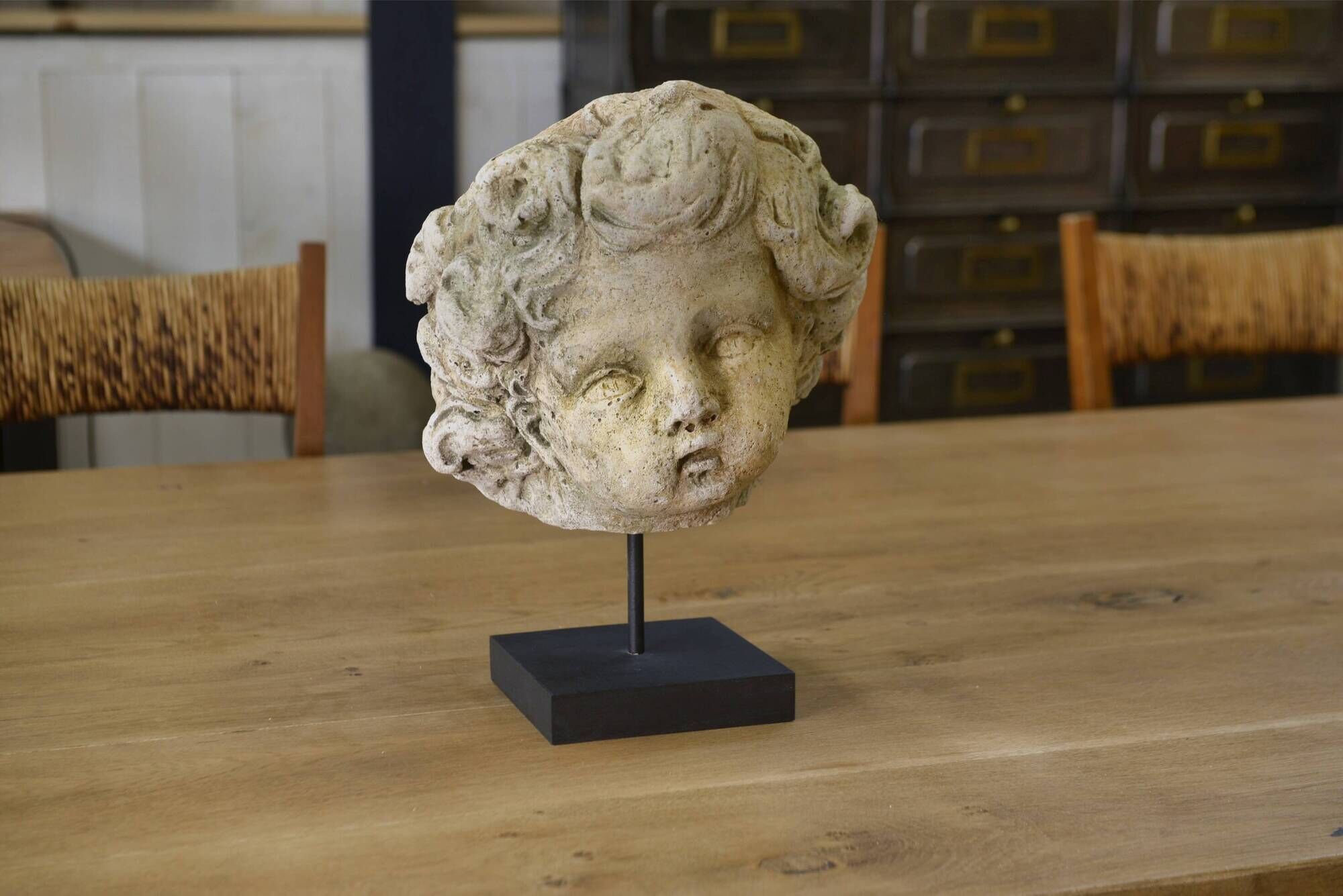 Reconstituted stone sculpture in antique style from the 20th century.