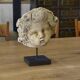 Reconstituted stone sculpture in antique style from the 20th century.
