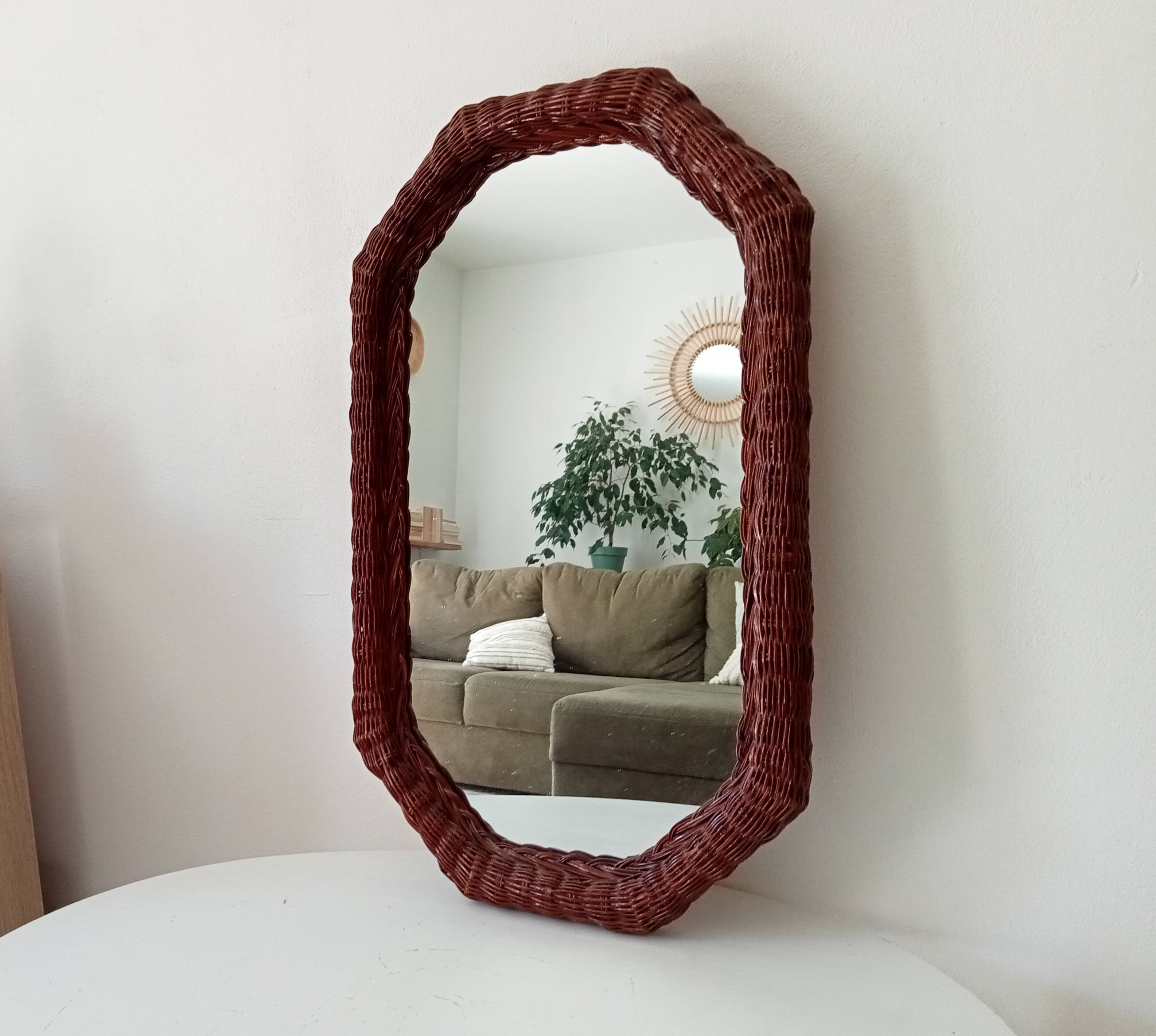 Vintage octagonal mirror in woven rattan.