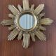 Vintage sun mirror in golden resin 60s/70s