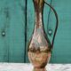 Carafe vase in chiseled brass