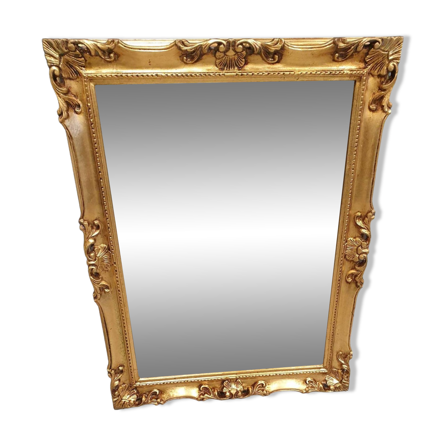 Beveled mirror and golden wood