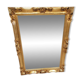 Beveled mirror and golden wood