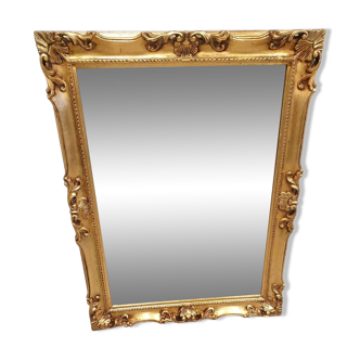 Beveled mirror and golden wood