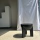 Black mango wood tripod side table with a semi-spherical top, height: 45 cm, diameter: 44 cm.