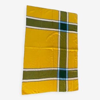 Yellow-orange and dark green tablecloth