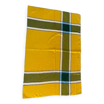 Yellow-orange and dark green tablecloth