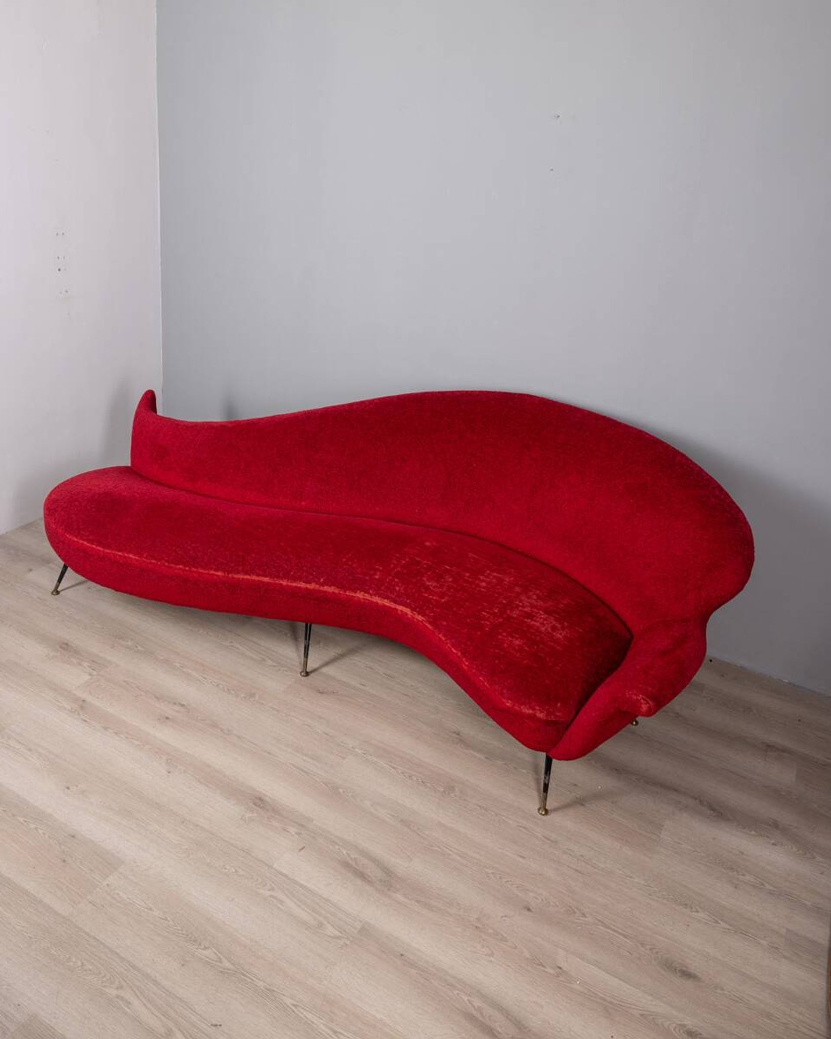Large 1950s vintage curved sofa in red velvet italian design
