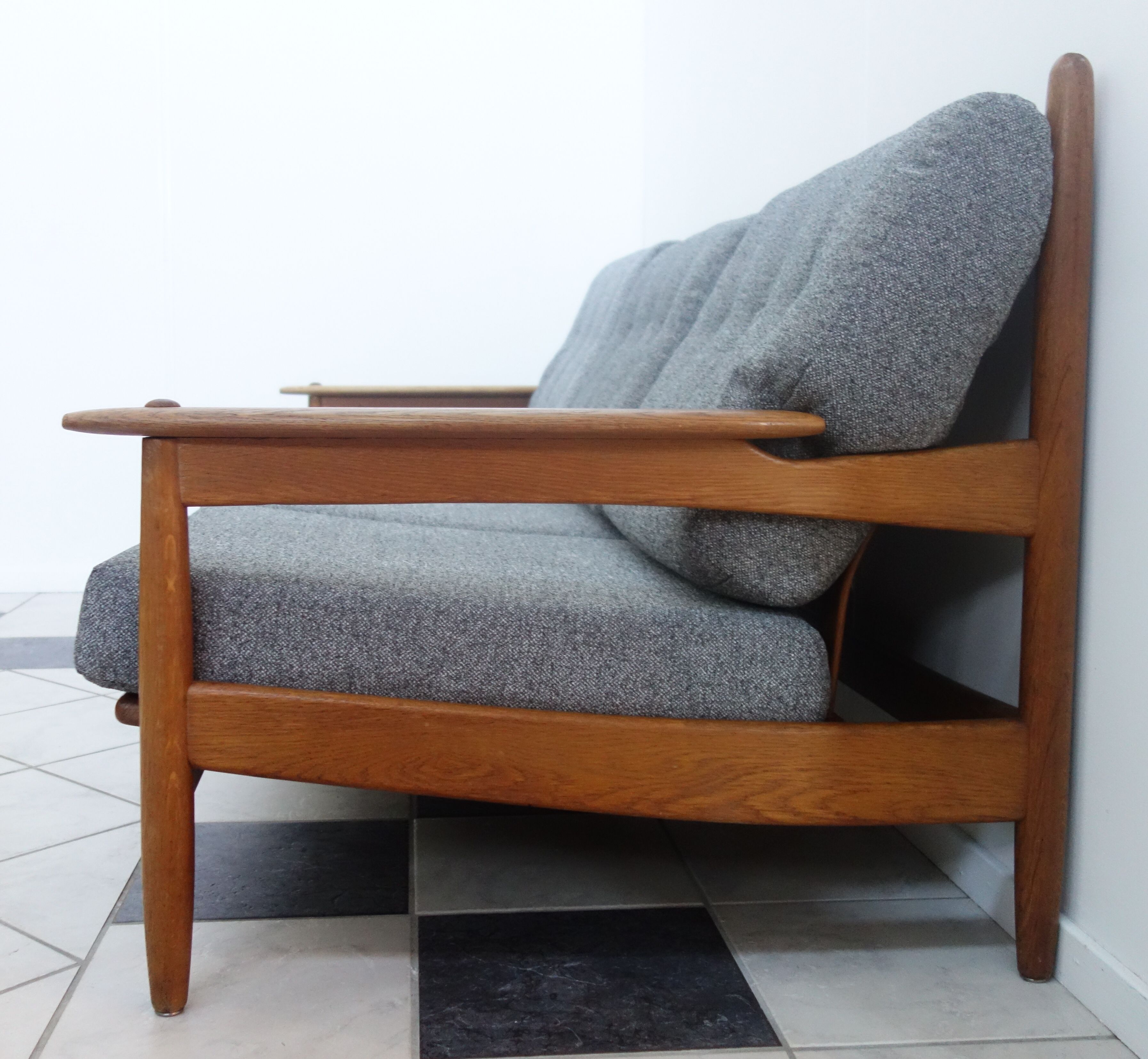 Three seater sofa in fabric and wood