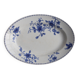Antique serving dish in white and blue earthenware.