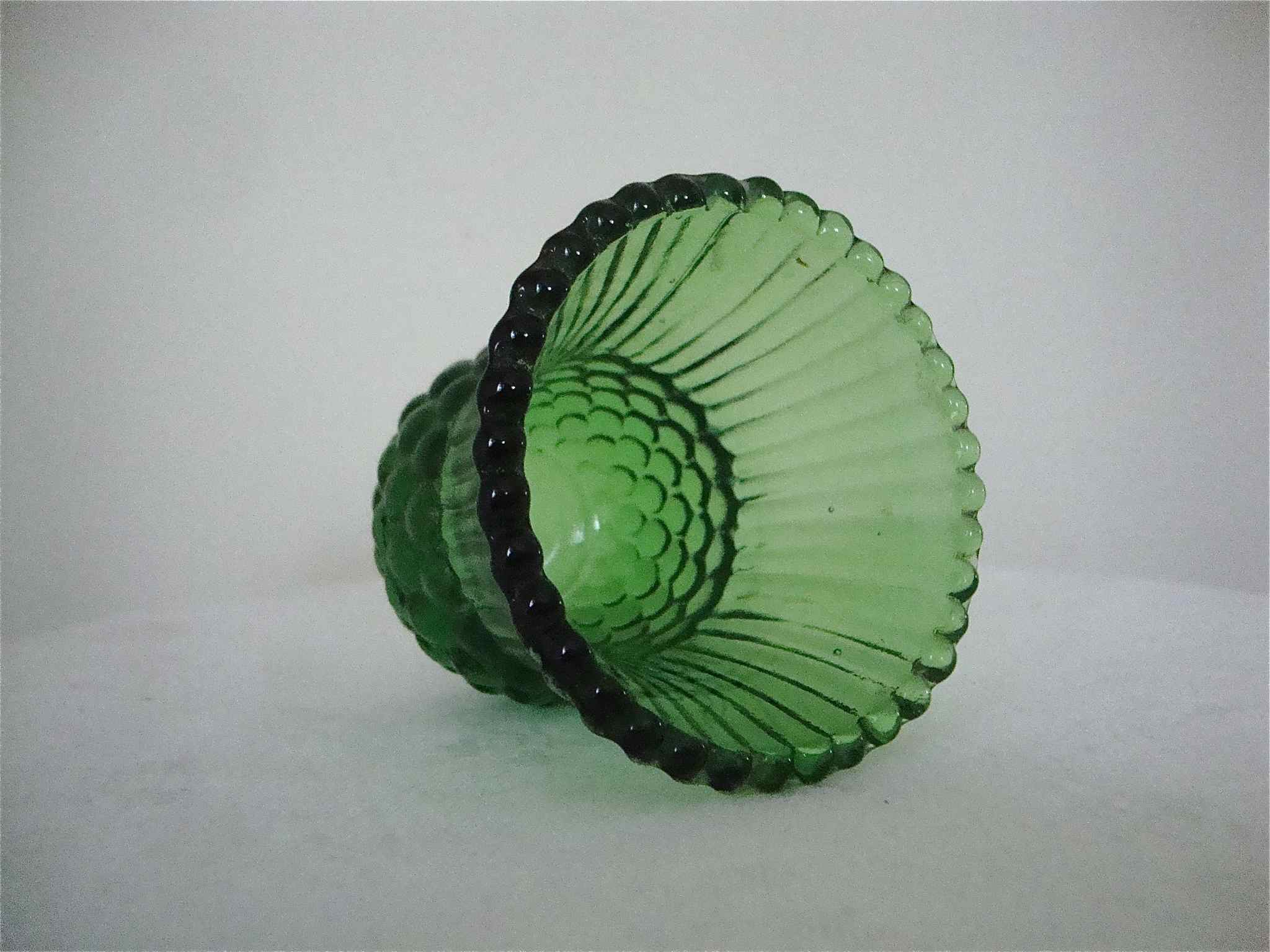 Very small green vase bottle