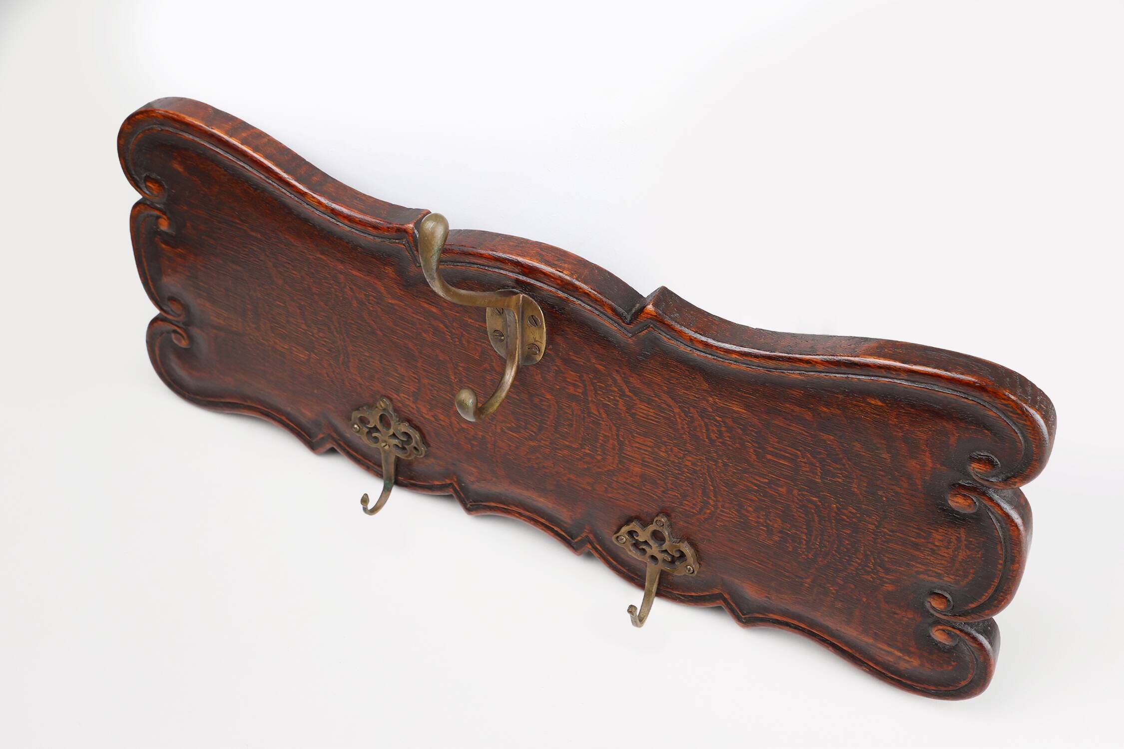 Art Nouveau style coat rack in oak with brass hooks, France ca. 1915