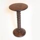 Wooden pedestal table with spiked columns