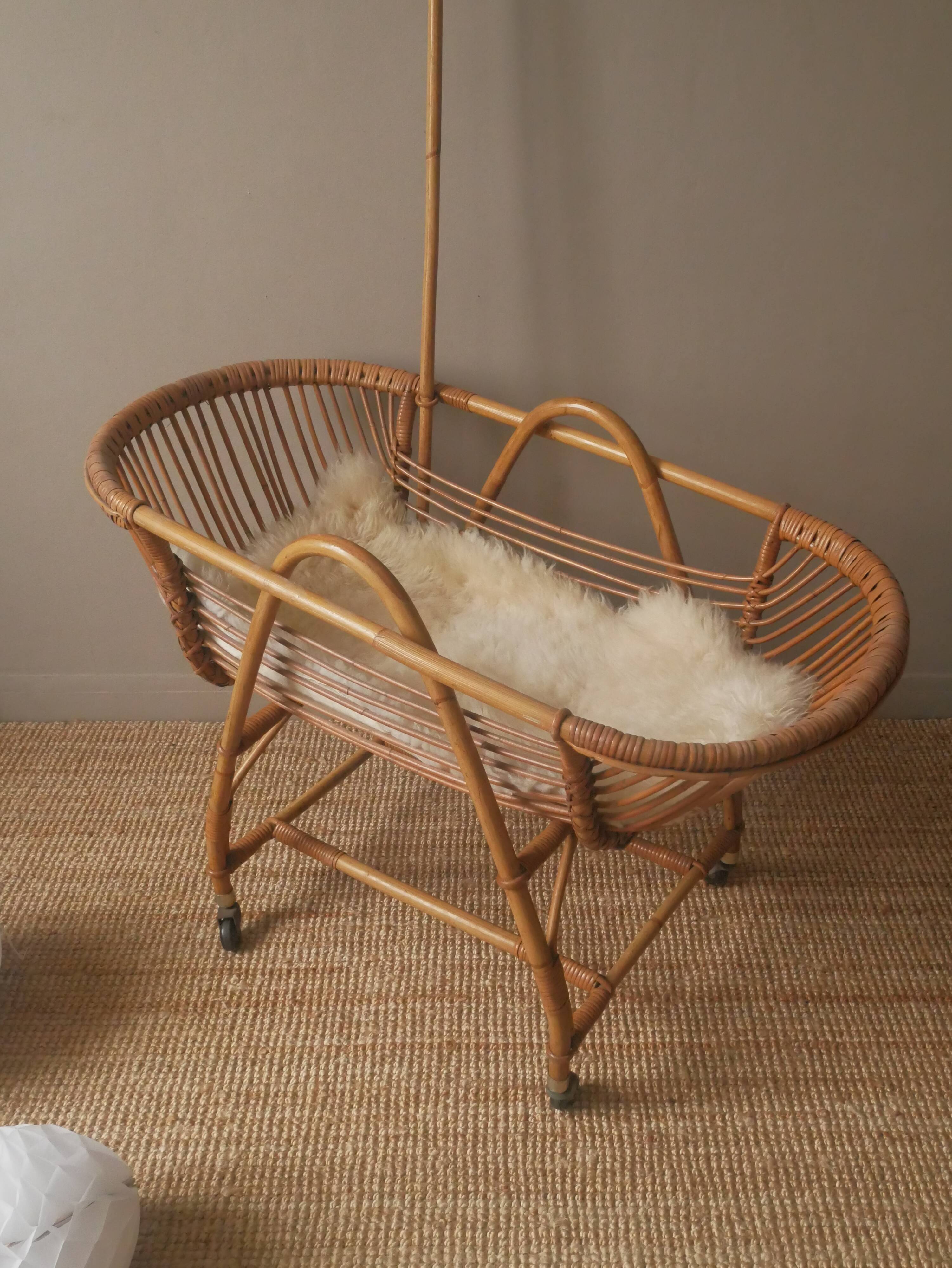 Vintage rattan cradle bassinet on wheels retro Scandinavian design baby bed