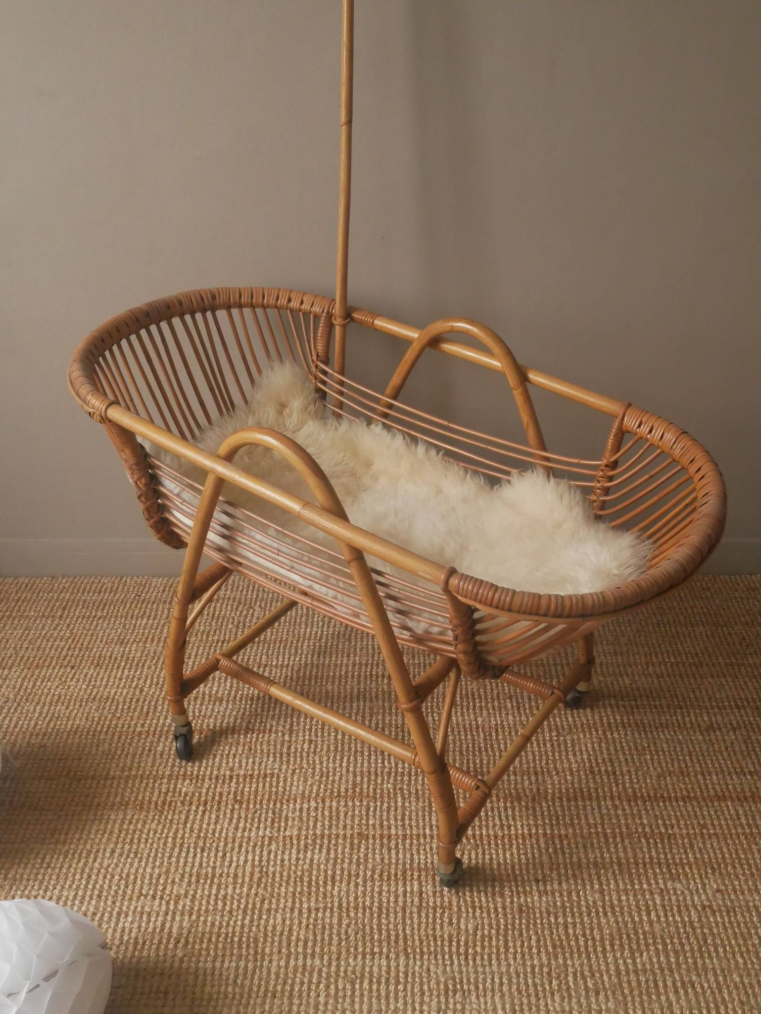 Vintage rattan cradle bassinet on wheels retro Scandinavian design baby bed