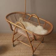 Vintage rattan cradle bassinet on wheels retro Scandinavian design baby bed