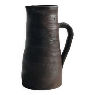 Pitcher, watering can in dark brown ceramic with matte finish.