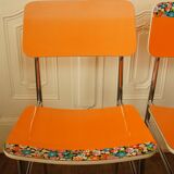 Pair of orange Formica "Tublac" chairs