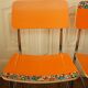 Pair of orange Formica "Tublac" chairs
