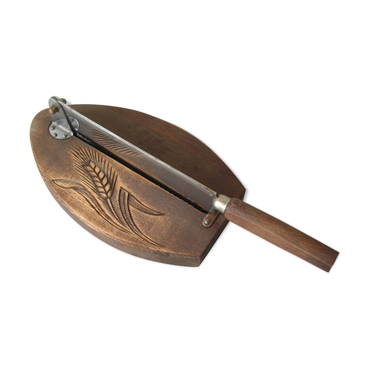 Old wooden bread cutter carved sheaf of wheat and metal deco kitchen Normandy countryside