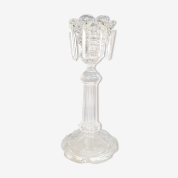 Old candlestick with molded glass stamps
