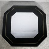 Miroir années 70, bois laqué noir, liseret  laiton. Octogonal