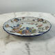 Flat plate in earthenware with polychrome decoration in Rouen style
