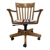 Solid wood swivel and reclining armchair.