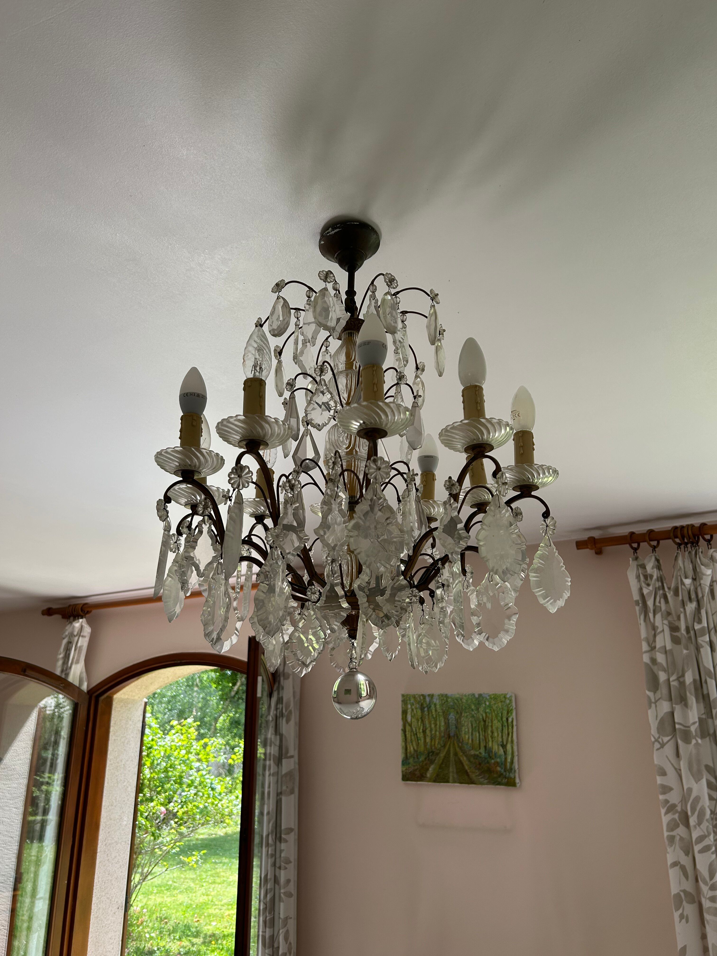 Lustre with 10 arms of light, antique with crystal pendants.