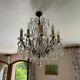 Lustre with 10 arms of light, antique with crystal pendants.