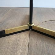 Designer floor lamp in black lacquered metal and brass