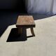 Small stool, rectangular solid teak side table with curved legs.