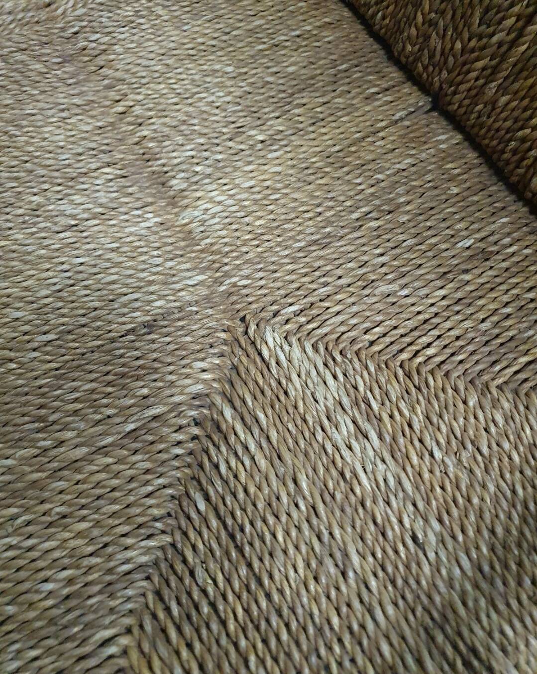 Vintage French papercord sofa with a metal frame base