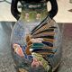 Large relief vase with parrot design