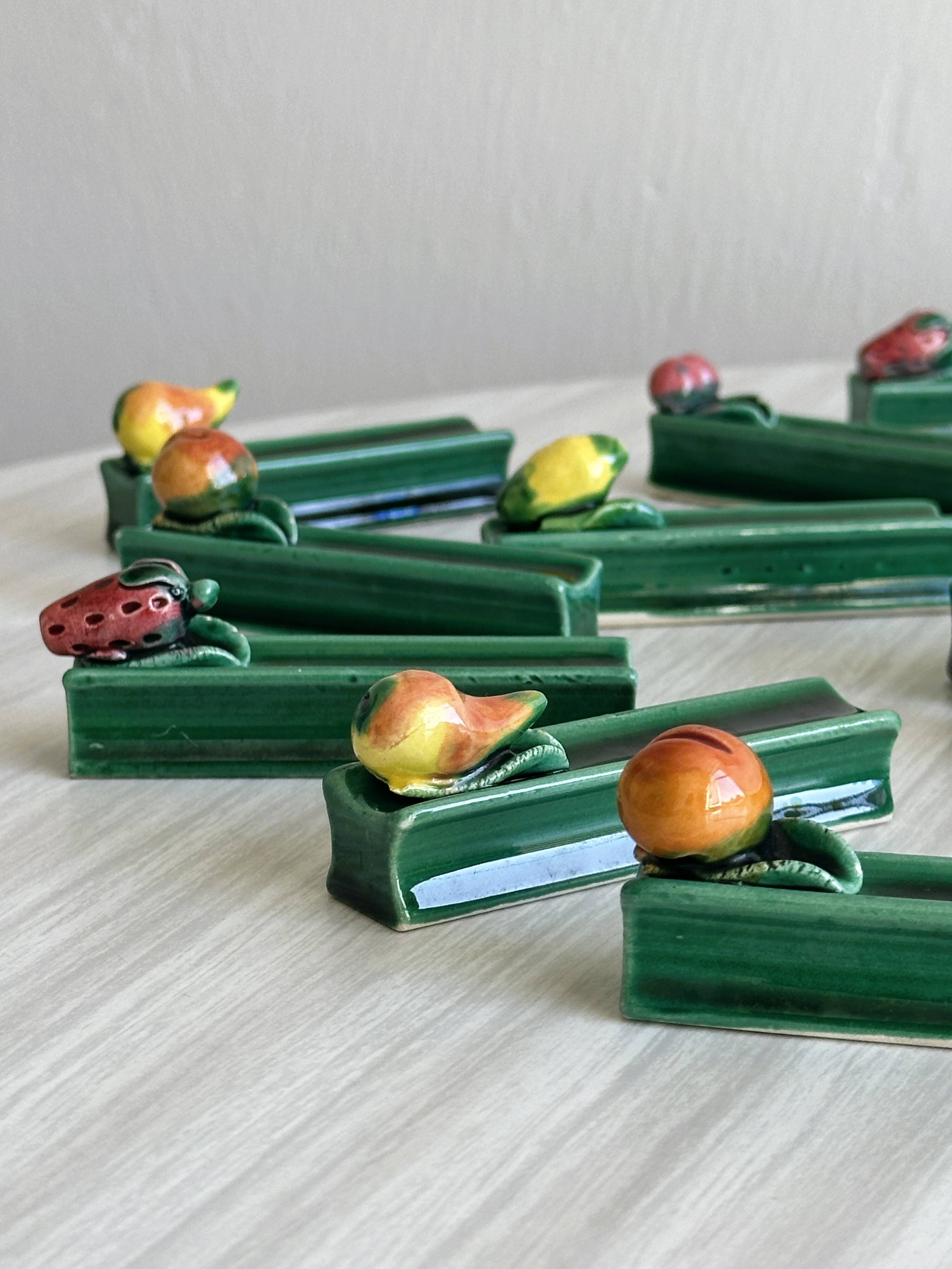 12 ceramic fruit knife holders.