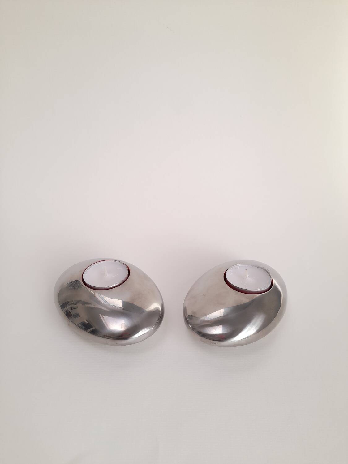 Pair of Nuance candle holders in the shape of pebbles.