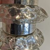 Table lamp made of transparent crystal glass and silver colored spacers.