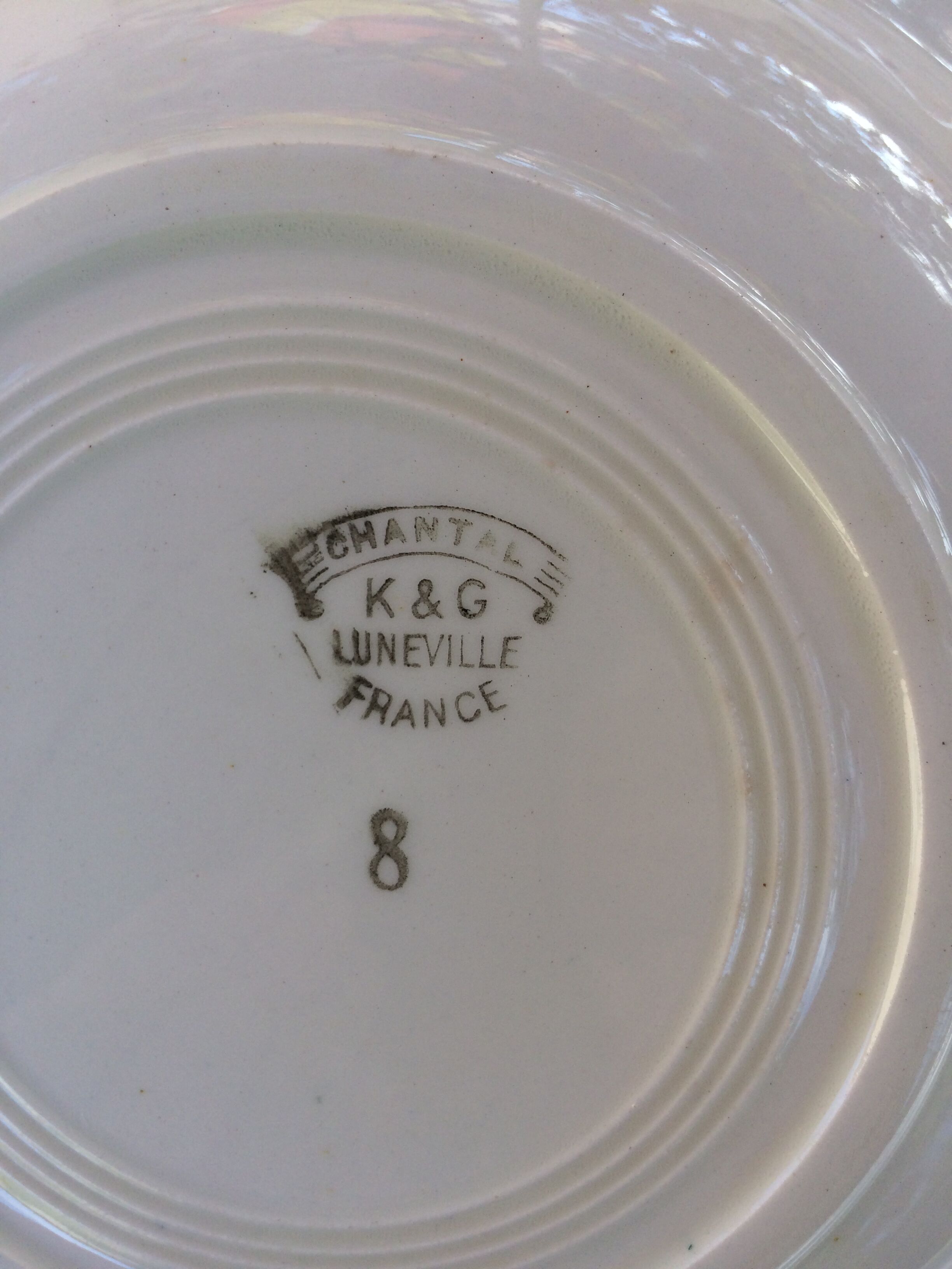 All 7 soup plates, a round deep dish and a flat oval Lunéville