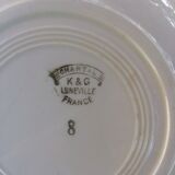 All 7 soup plates, a round deep dish and a flat oval Lunéville