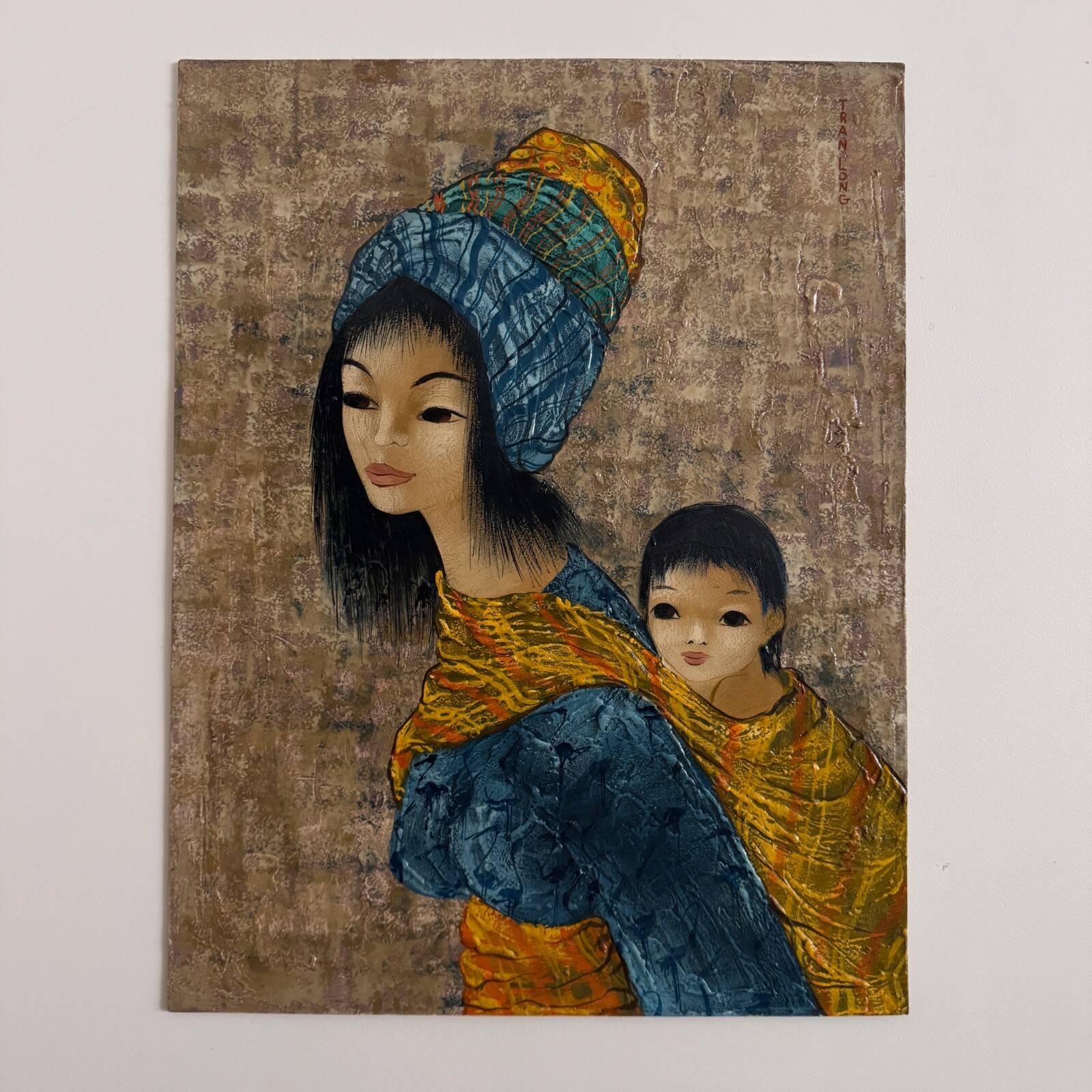 Acrylic on cardboard by Tran Long a mother carrying her child