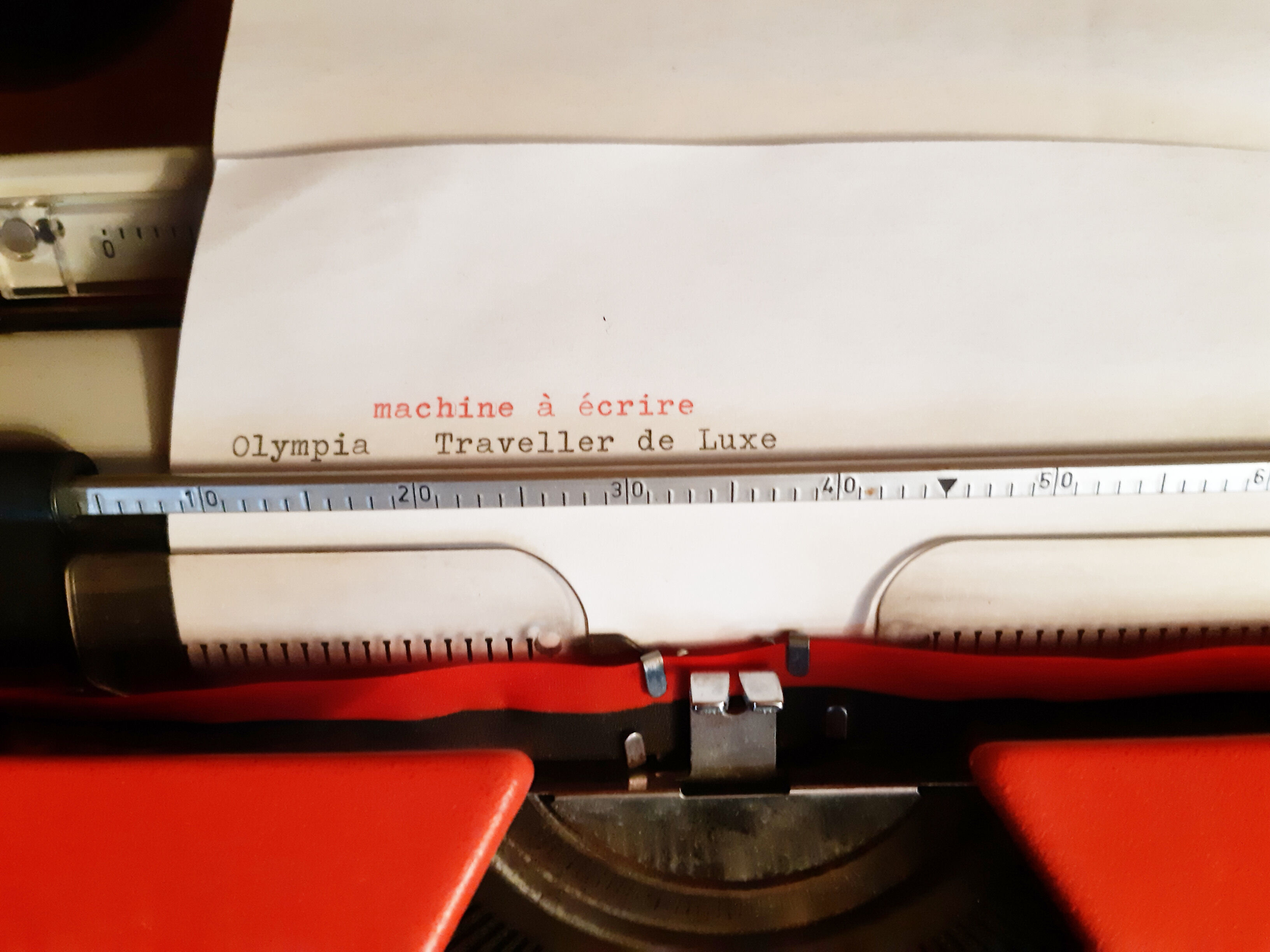 Portable typewriter " Olympia traveller de luxe " , red , in working order
