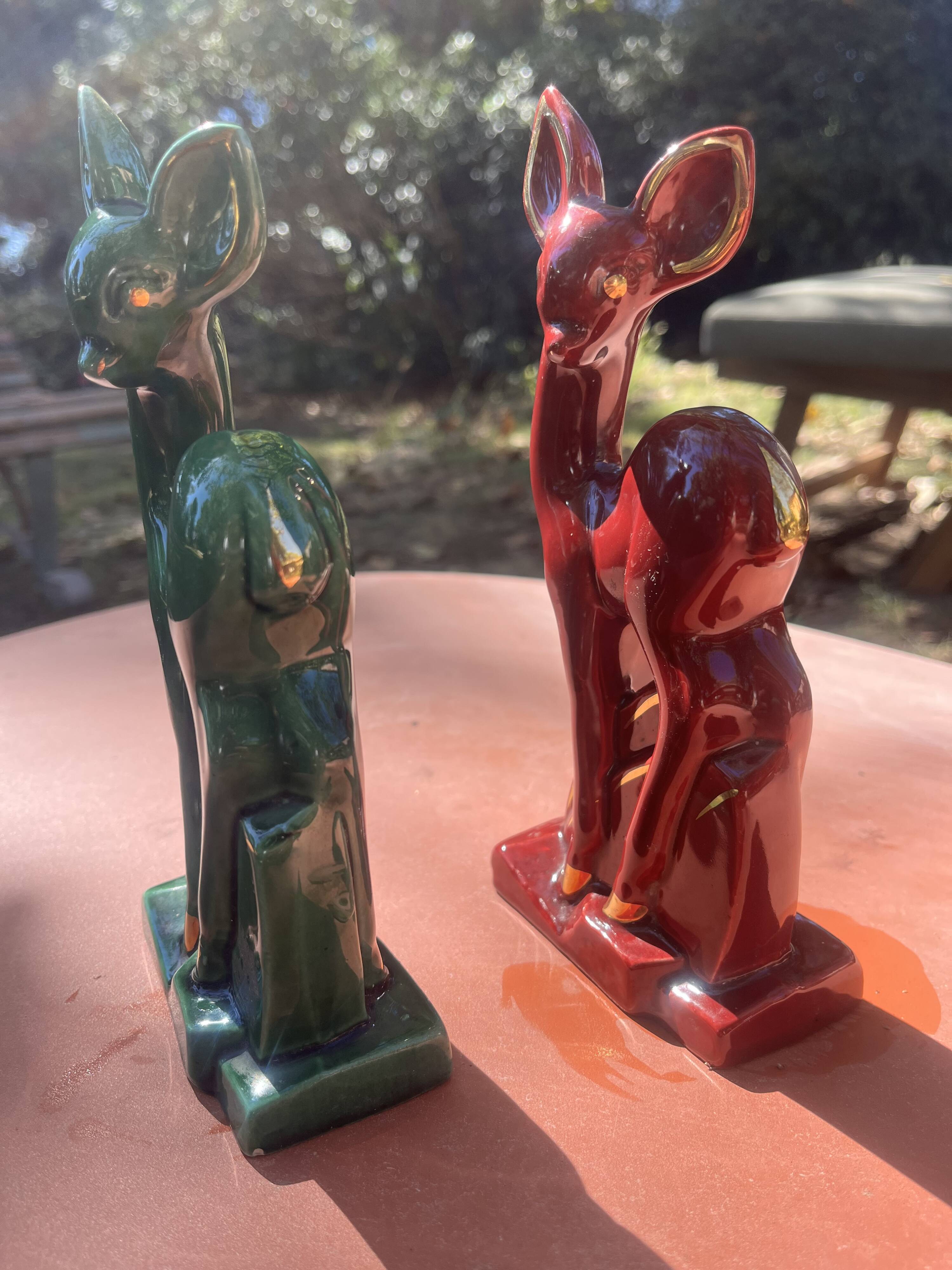 Pair of Art Deco deer by Charles Lemanceau in red and green ceramic.