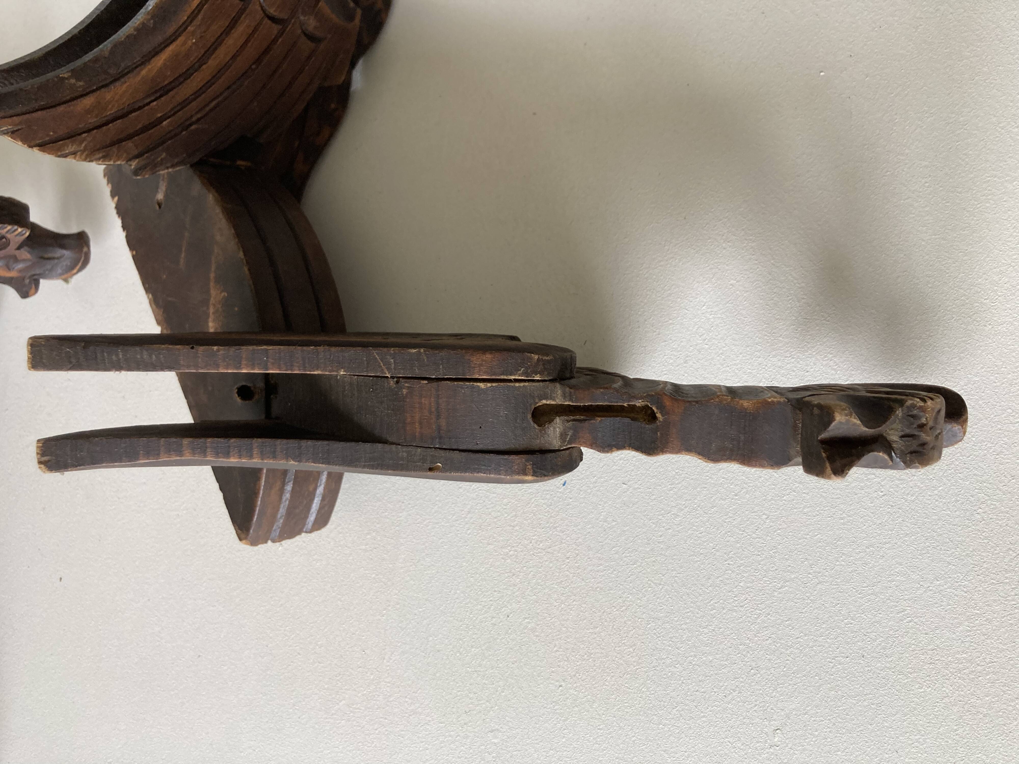 Pair of winged dragon sconces in carved wood