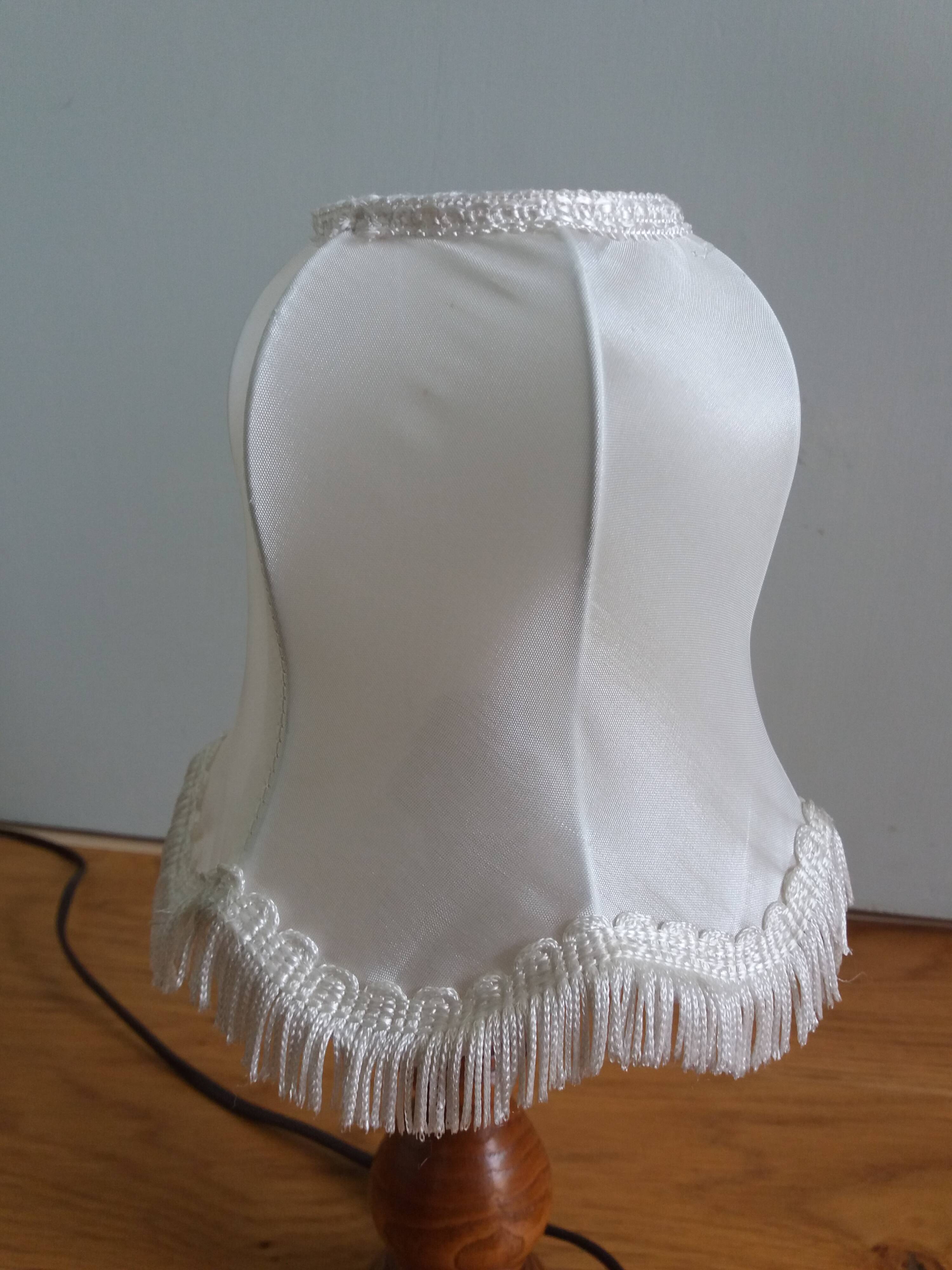 Turned wood lamp with fabric lampshade